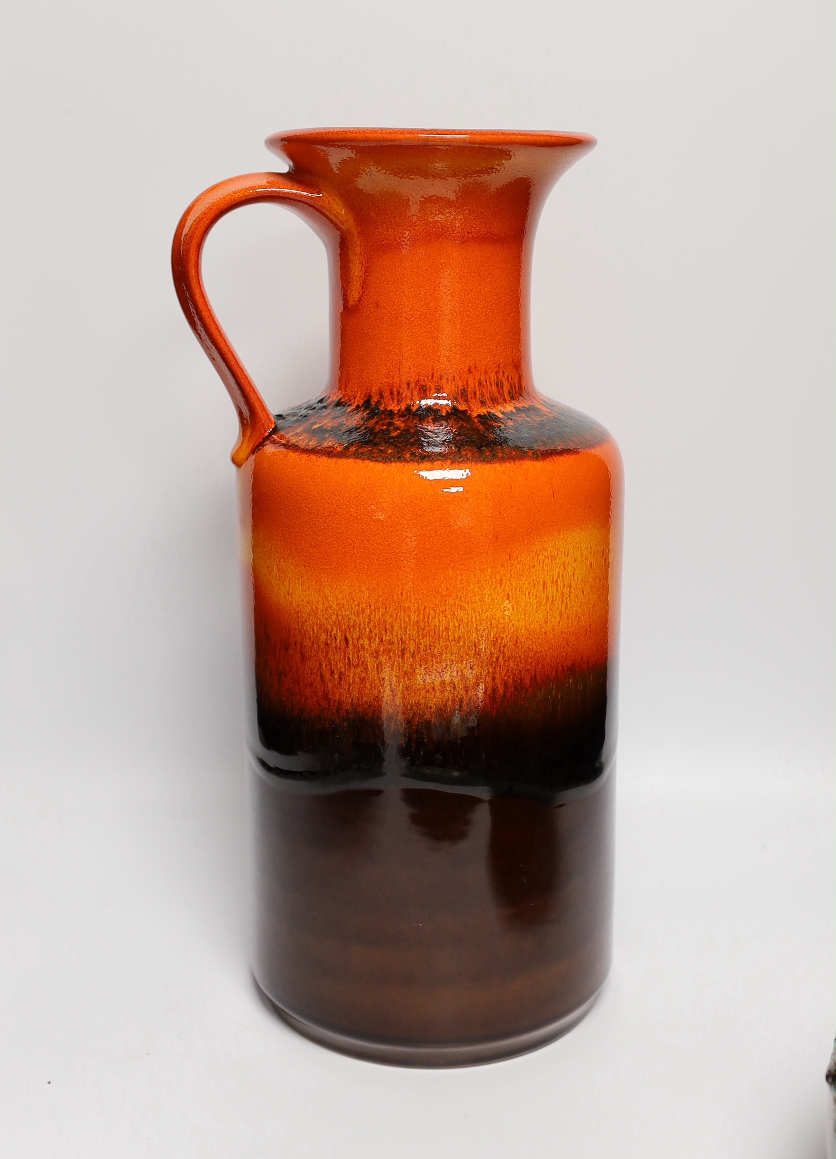 Five mid century pottery pieces including a Joyce Morgan 'cat' tray, an Adderley blue ground vase, and three W. German vases including 'Fat Larva' vase, tallest 42cm